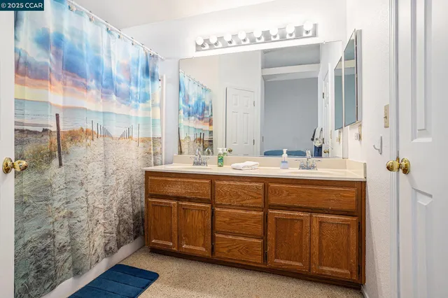 a swimming pool with an outdoor space and seating area