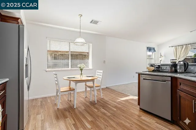 a kitchen with a table and chairs in it