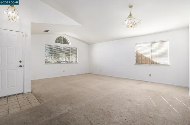 a bedroom with a bed and a chair