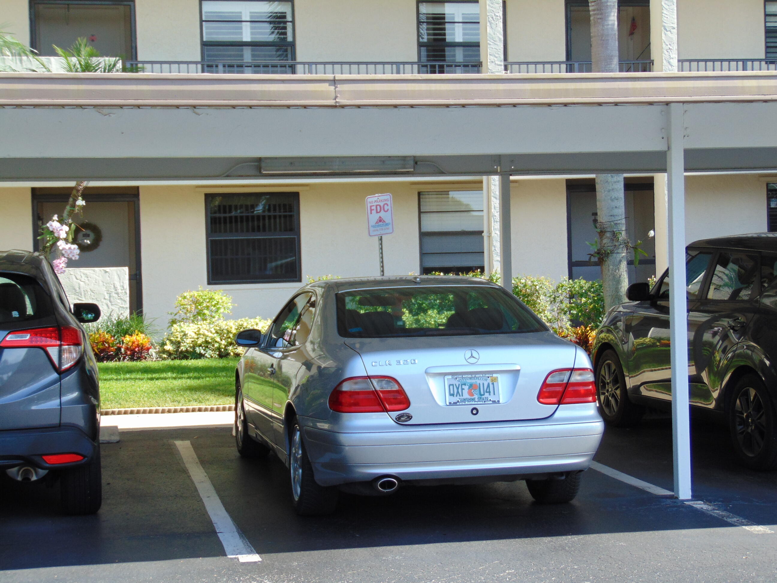 9220 Southwest 14th Street, Unit 3103 Boca Raton, FL 33428 - Photo 5 of 58 a car parked in front of a building