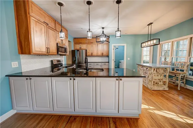 a living room with furniture fireplace and a flat screen tv