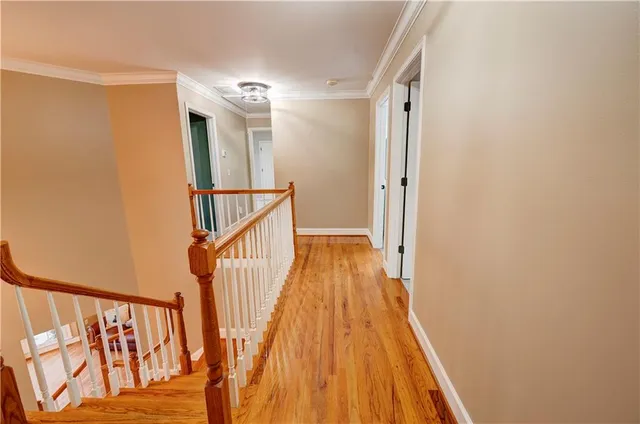 a living room with furniture and large windows