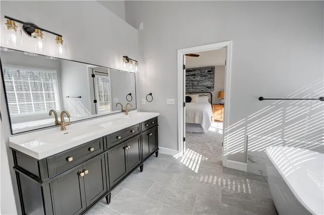 a view of a house with backyard and deck