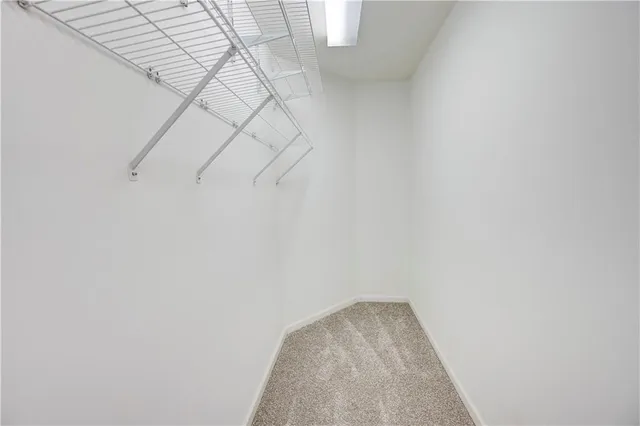 a front view of a house with glass windows and brick walls