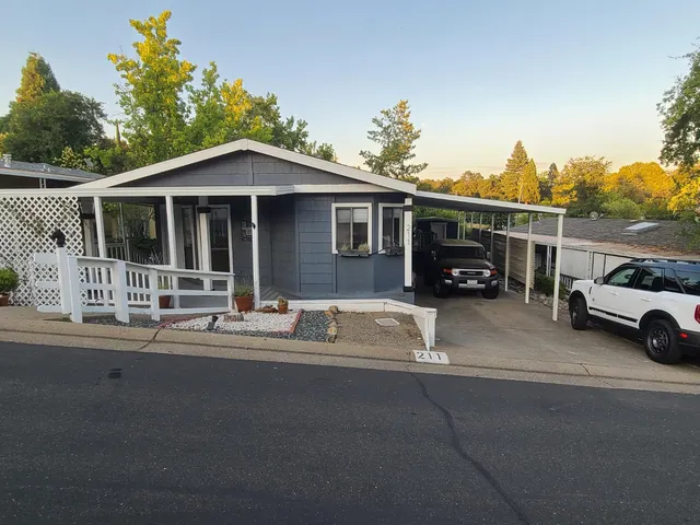 a view of a car park in front of house