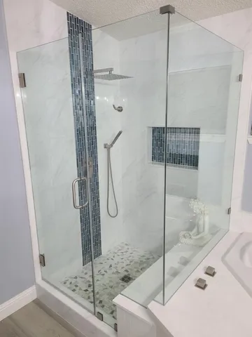 a kitchen with stainless steel appliances a refrigerator and a stove