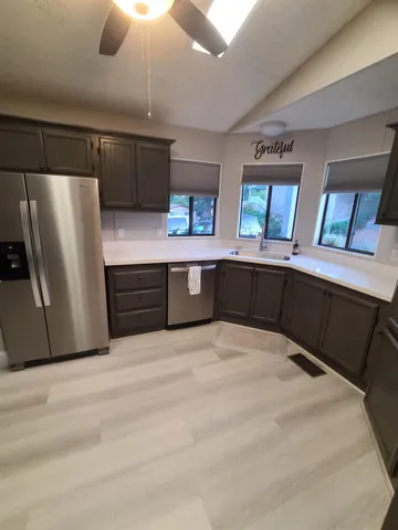 a white refrigerator freezer sitting in a kitchen
