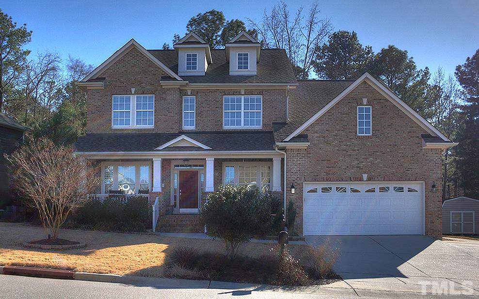 10008 Darling Street Raleigh, NC 27613 - Photo 1 of 24 a front view of a house with garden