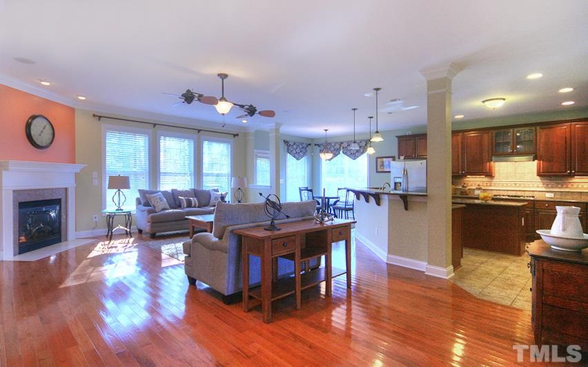 10008 Darling Street Raleigh, NC 27613 - Photo 4 of 24 a large kitchen with a table and chairs