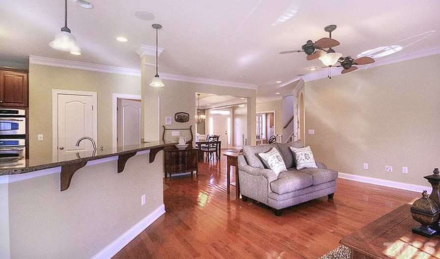 10008 Darling Street Raleigh, NC 27613 - Photo 5 of 24 a living room with furniture and wooden floor