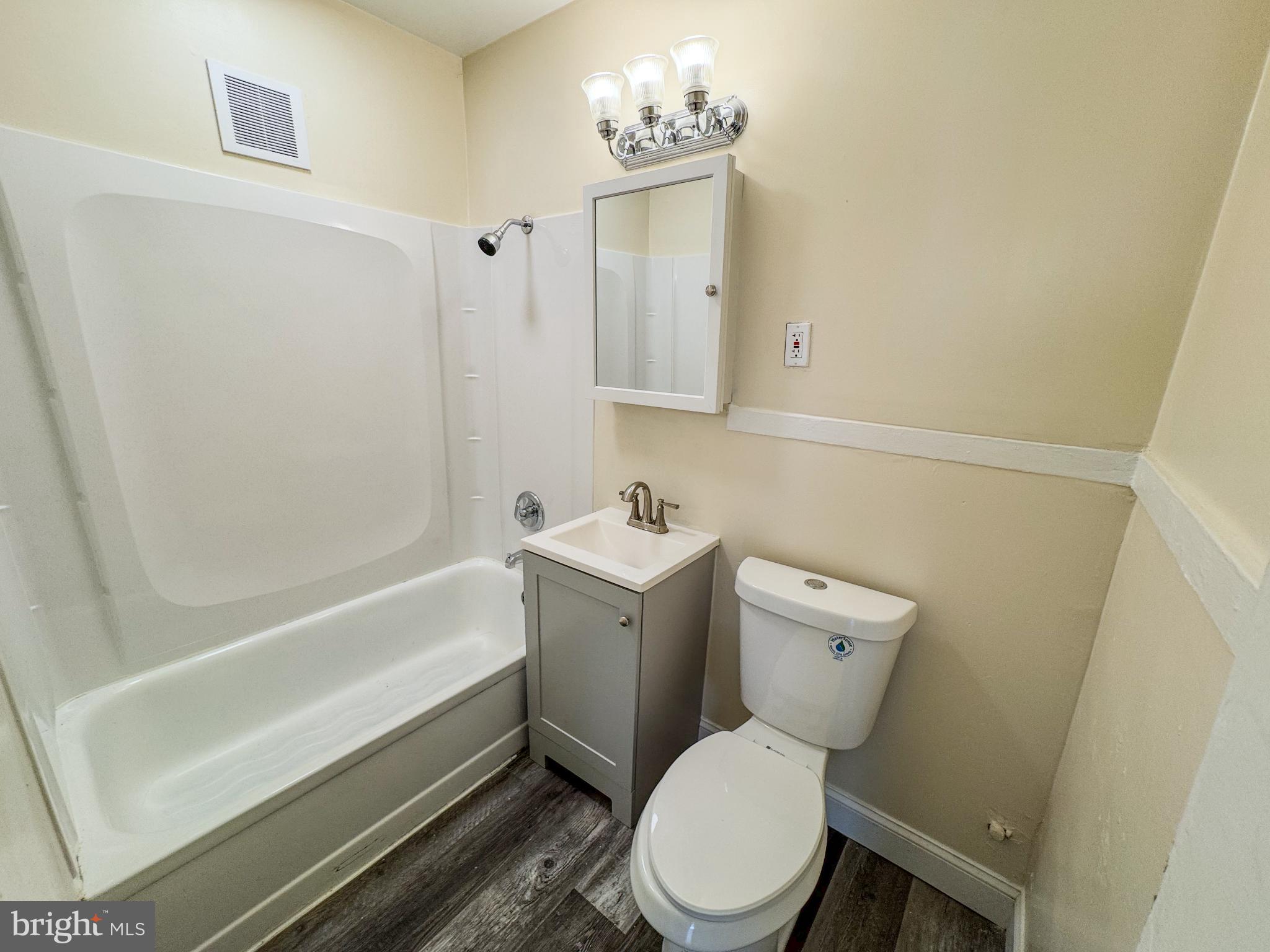 703 Dover Court Wallingford, PA 19086 - Photo 4 of 13 a white toilet sitting next to a bath tub