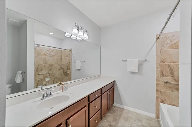 a bathroom with a sink double vanity and a mirror