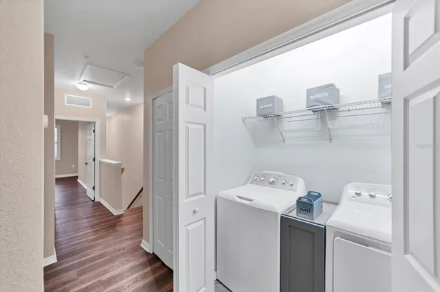 a view of a storage & utility room with closet dryer