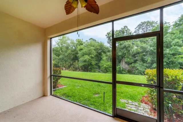 a view of field with trees in the background