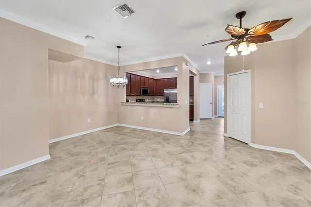a view of a kitchen with a microwave and a ceiling fan