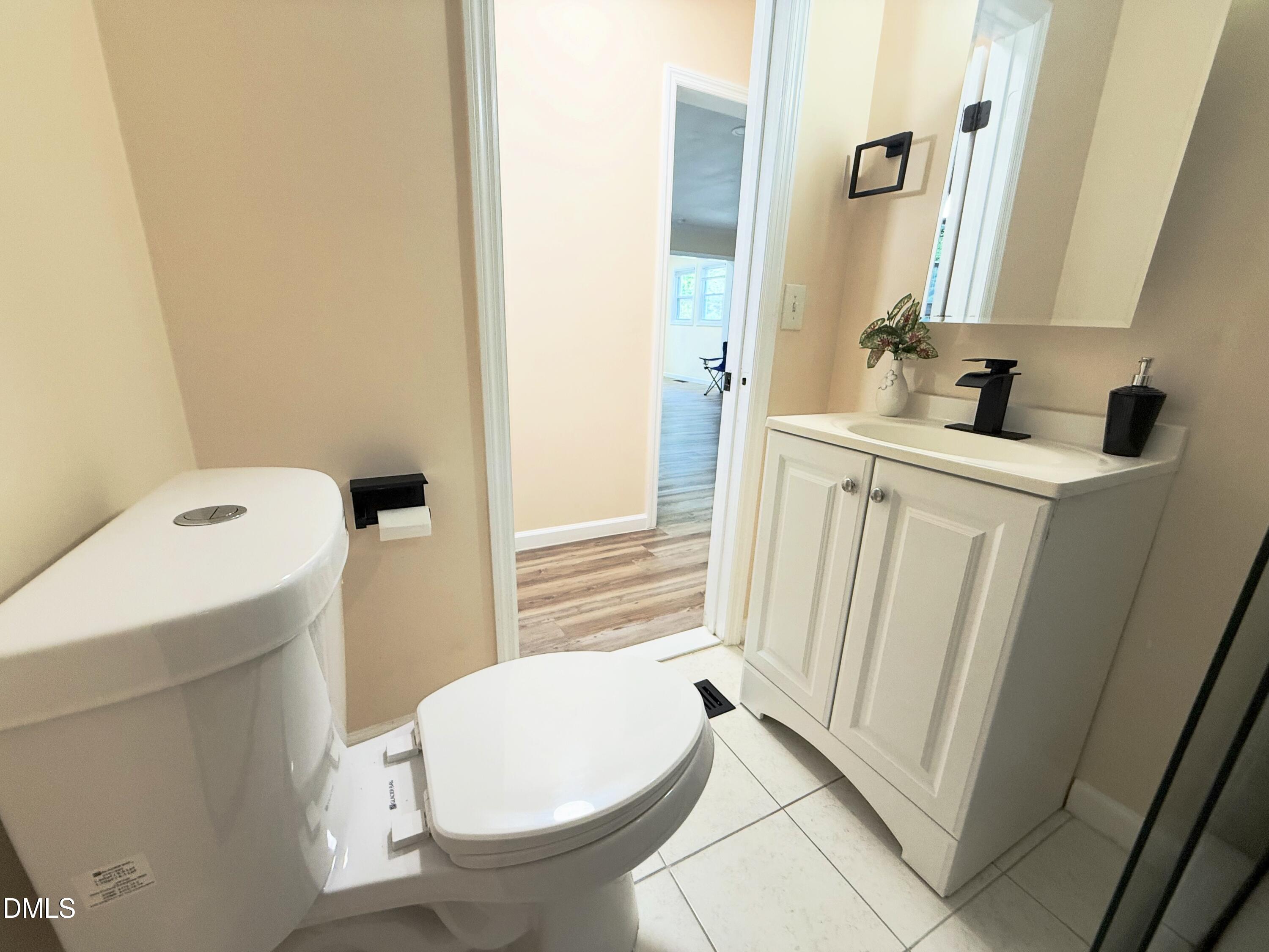 417 North Street Graham, NC 27253 - Photo 13 of 18 a bathroom with a sink and toilet