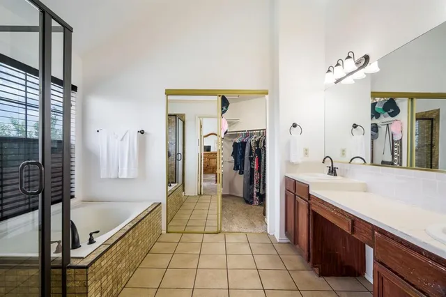 a bathroom with a sink a mirror and a bathtub