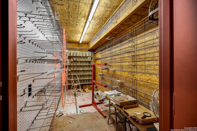 a view of a room with wooden floor and windows