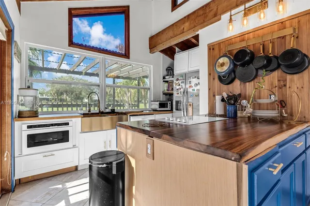 a kitchen with stainless steel appliances granite countertop a stove and a sink