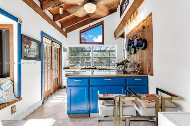 a room with wooden floor and a chandelier