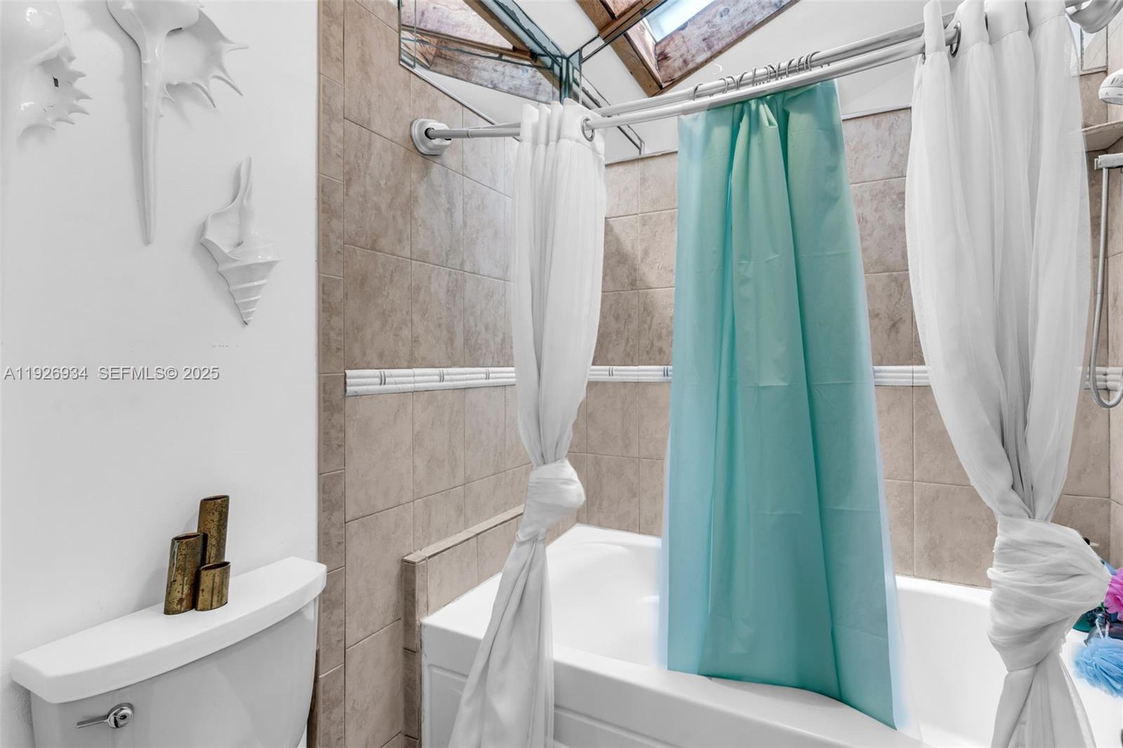 1420 West Sandpiper Circle, Unit 1420 Pembroke Pines, FL 33026 - Photo 21 of 38 a bathroom with a shower and a sink