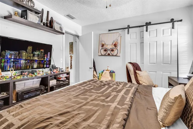 a bathroom with a toilet and a mirror