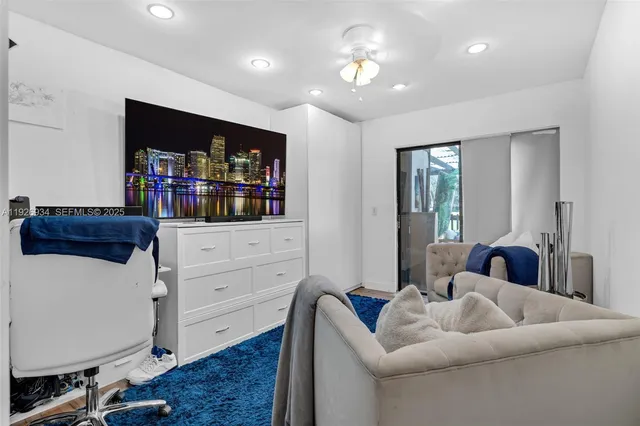 a livingroom with workspace and a couch