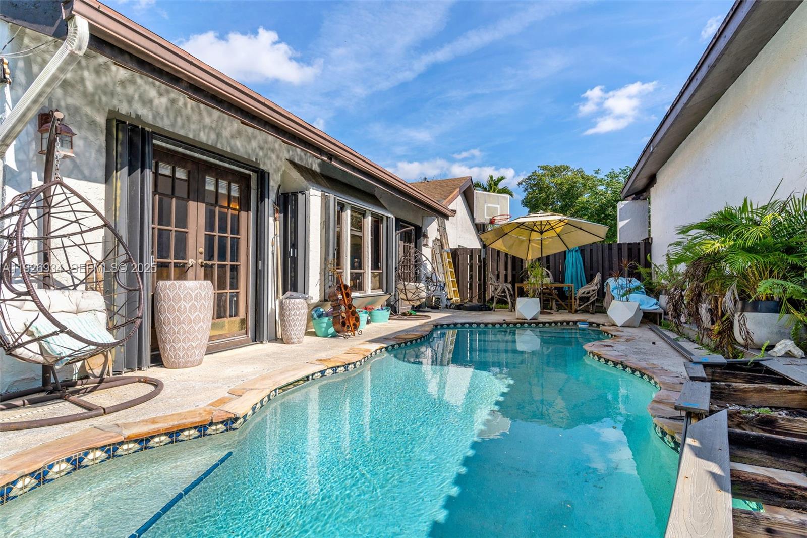 1420 West Sandpiper Circle, Unit 1420 Pembroke Pines, FL 33026 - Photo 30 of 38 a view of a house with swimming pool and sitting area
