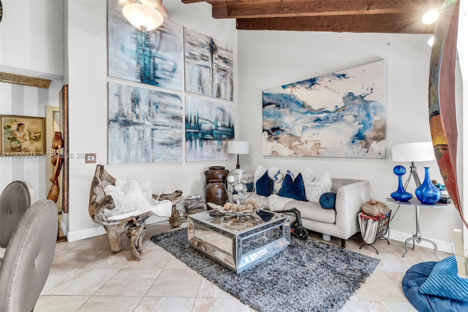 1420 West Sandpiper Circle, Unit 1420 Pembroke Pines, FL 33026 - Photo 3 of 38 a living room with furniture and a painting on the wall