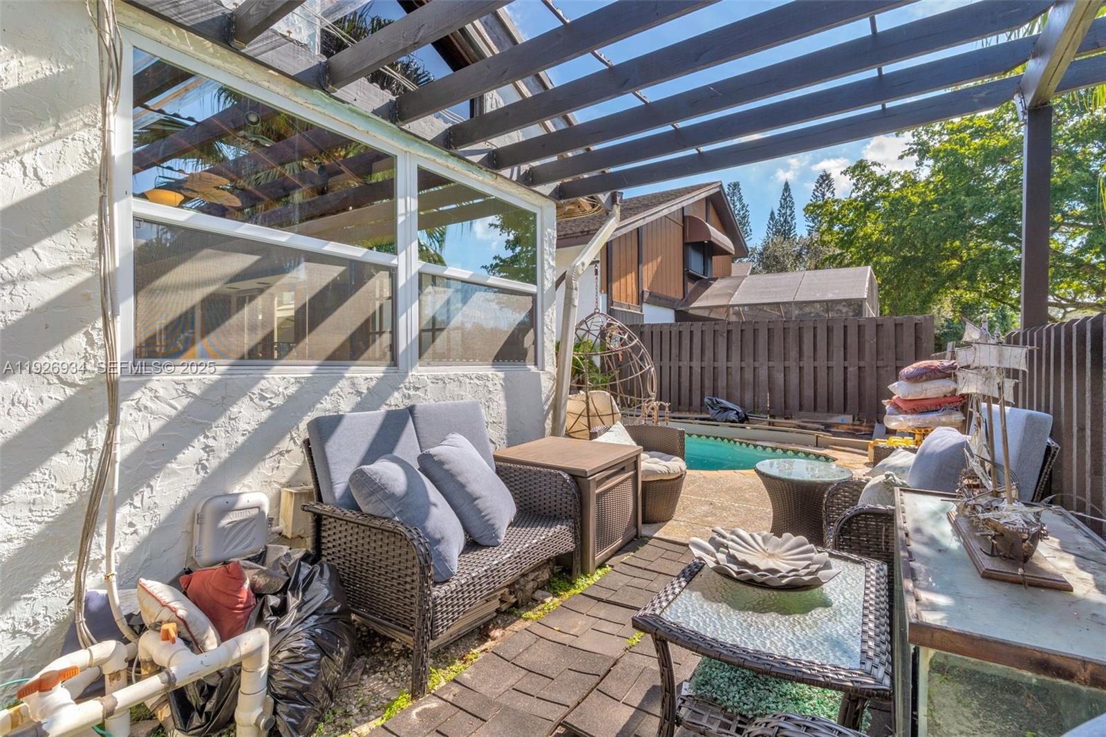 1420 West Sandpiper Circle, Unit 1420 Pembroke Pines, FL 33026 - Photo 31 of 38 a view of porch with seating space