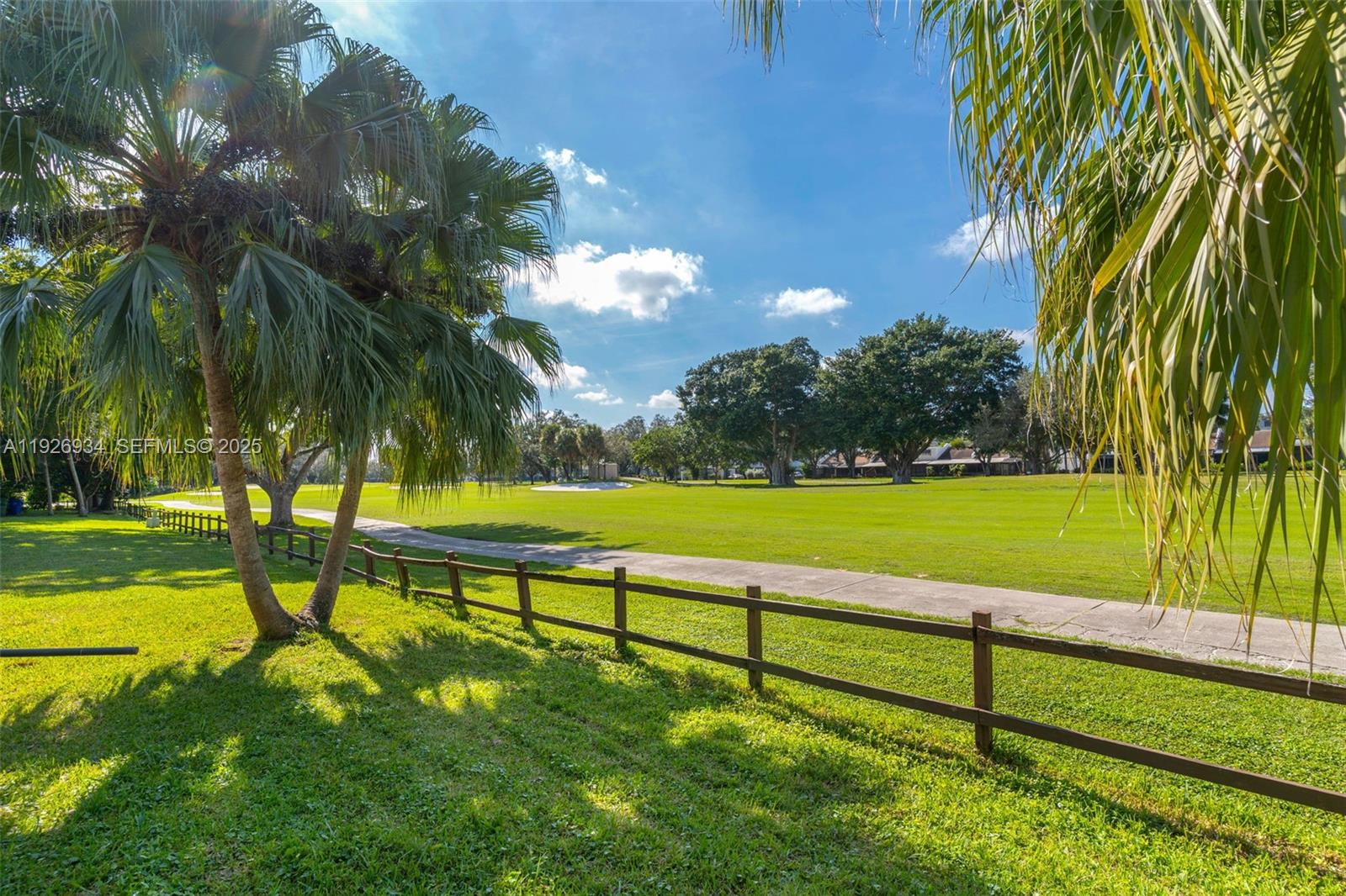 1420 West Sandpiper Circle, Unit 1420 Pembroke Pines, FL 33026 - Photo 32 of 38 a view of a park with palm trees