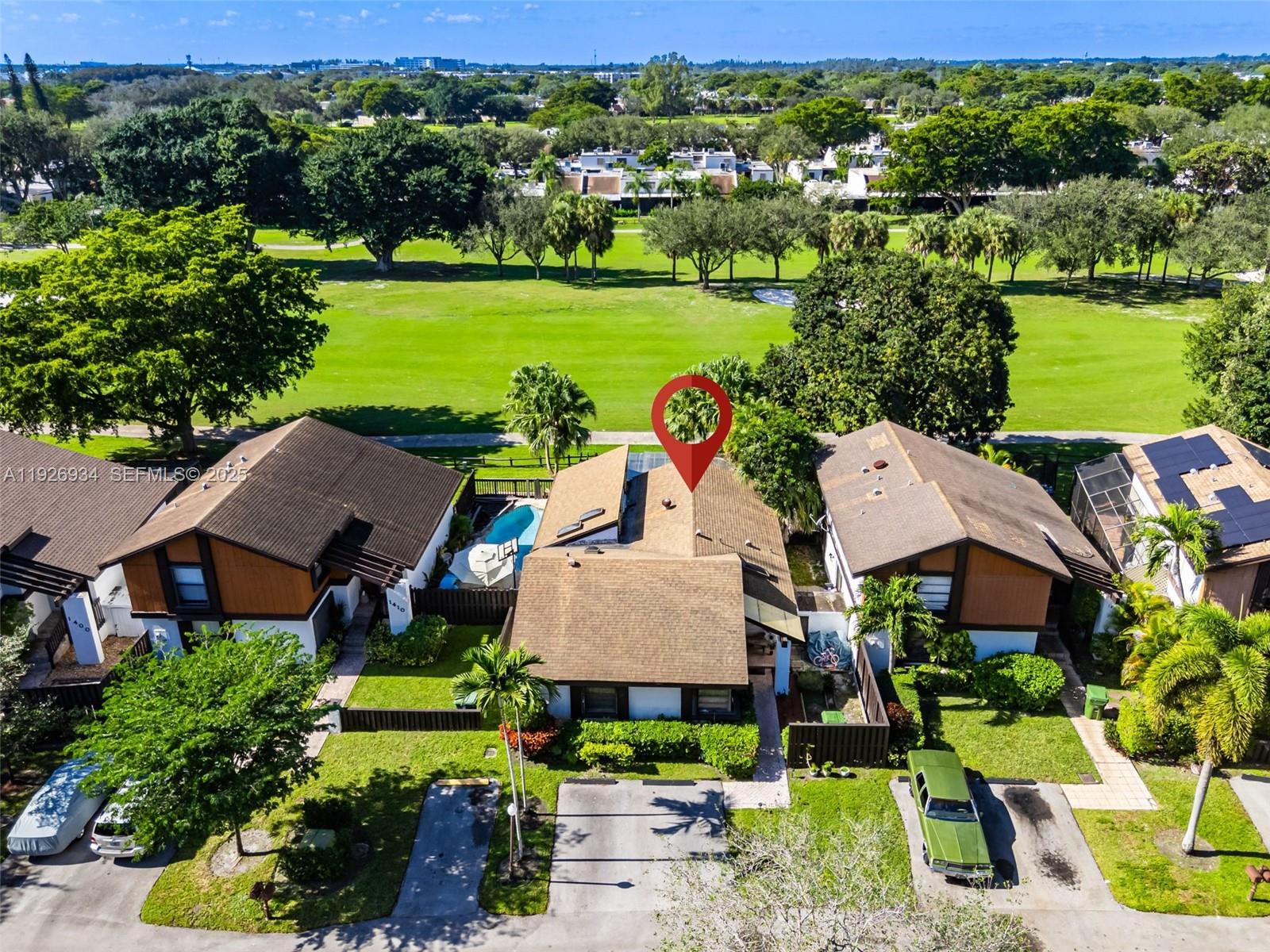 1420 West Sandpiper Circle, Unit 1420 Pembroke Pines, FL 33026 - Photo 33 of 38 an aerial view of multiple houses with yard