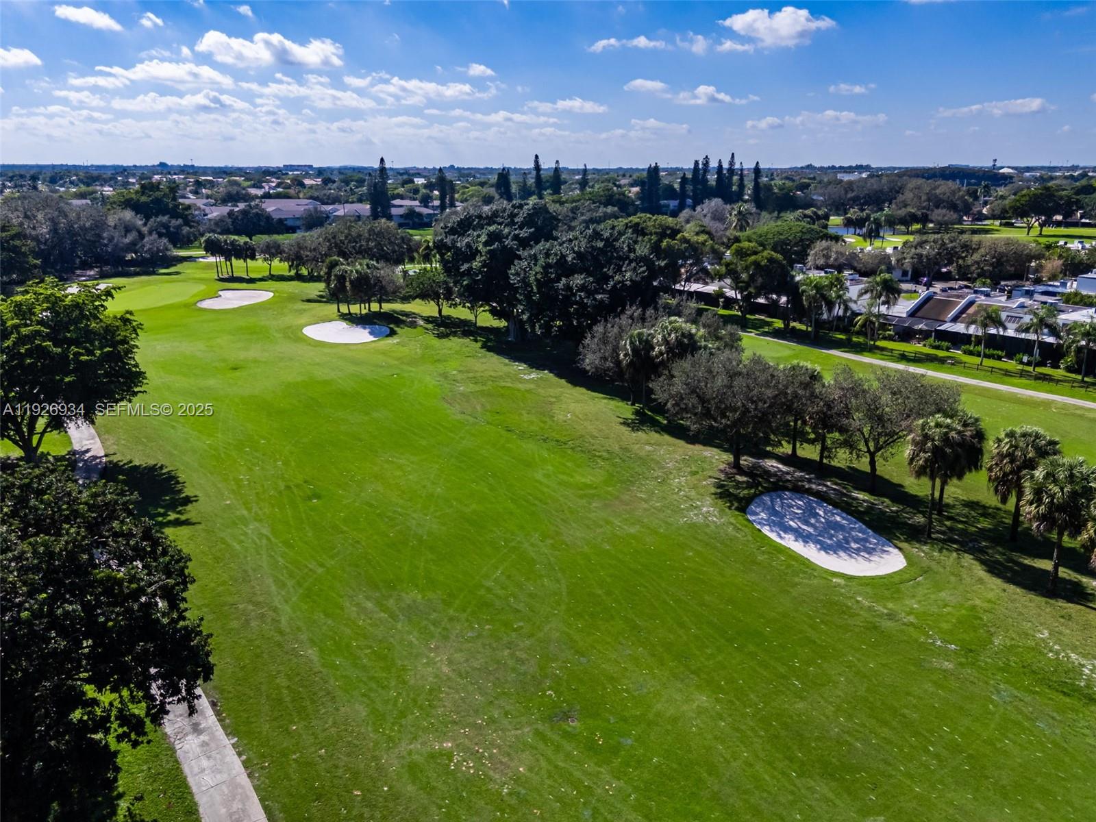1420 West Sandpiper Circle, Unit 1420 Pembroke Pines, FL 33026 - Photo 34 of 38 a view of a lake with a city