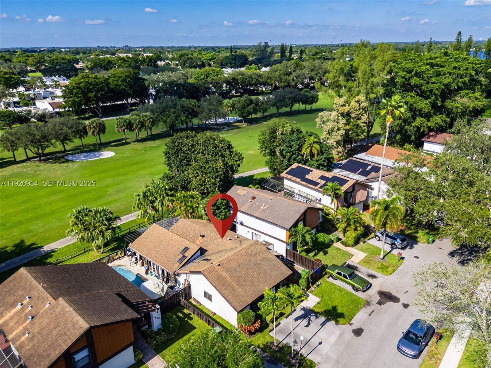 1420 West Sandpiper Circle, Unit 1420 Pembroke Pines, FL 33026 - Photo 36 of 38 an aerial view of a house with garden space and street view