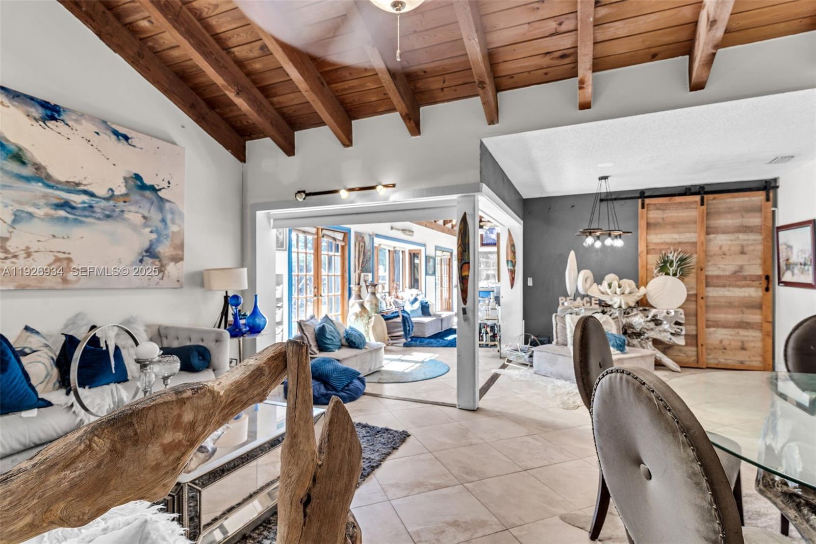 1420 West Sandpiper Circle, Unit 1420 Pembroke Pines, FL 33026 - Photo 5 of 38 a living room with furniture and a large window