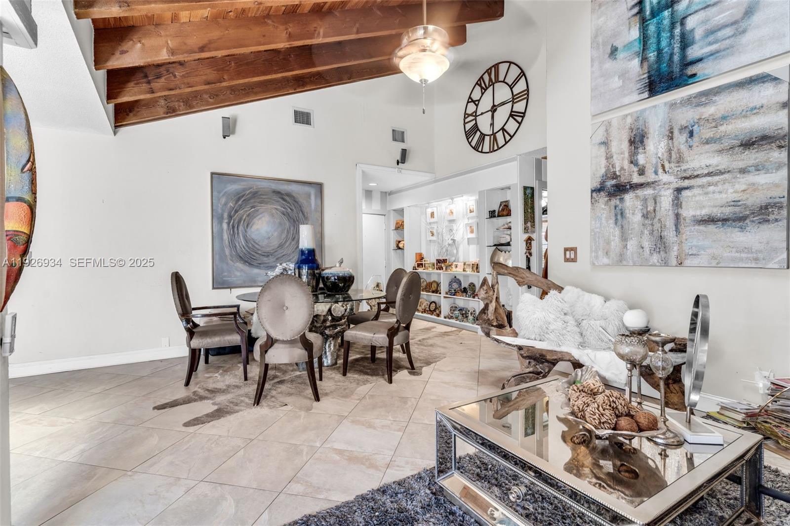 1420 West Sandpiper Circle, Unit 1420 Pembroke Pines, FL 33026 - Photo 6 of 38 a living room with furniture and a table