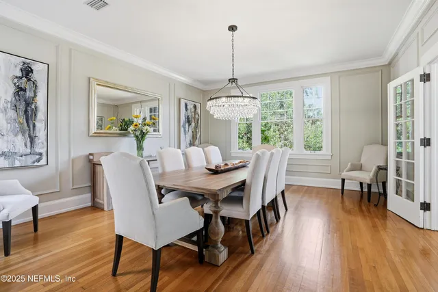 a dining room with furniture window wooden floor