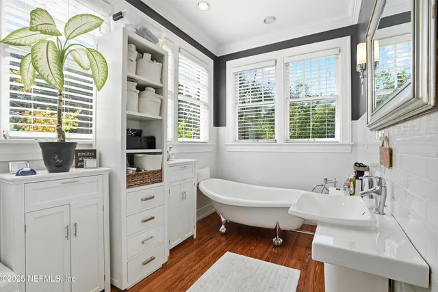 a bedroom with a large bed and a large window