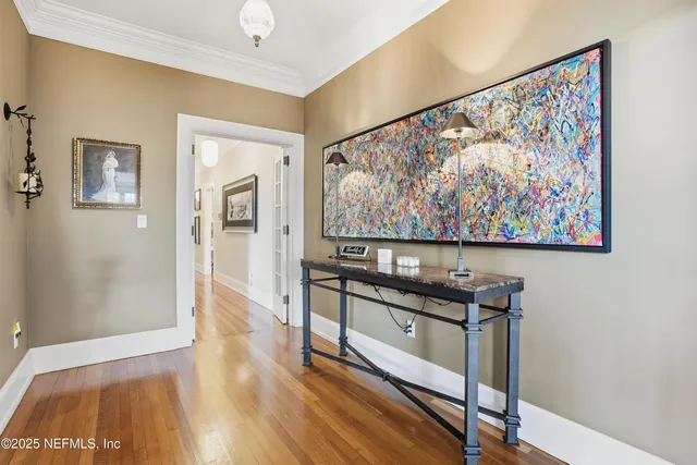 a kitchen with stainless steel appliances granite countertop a stove and a wooden floor