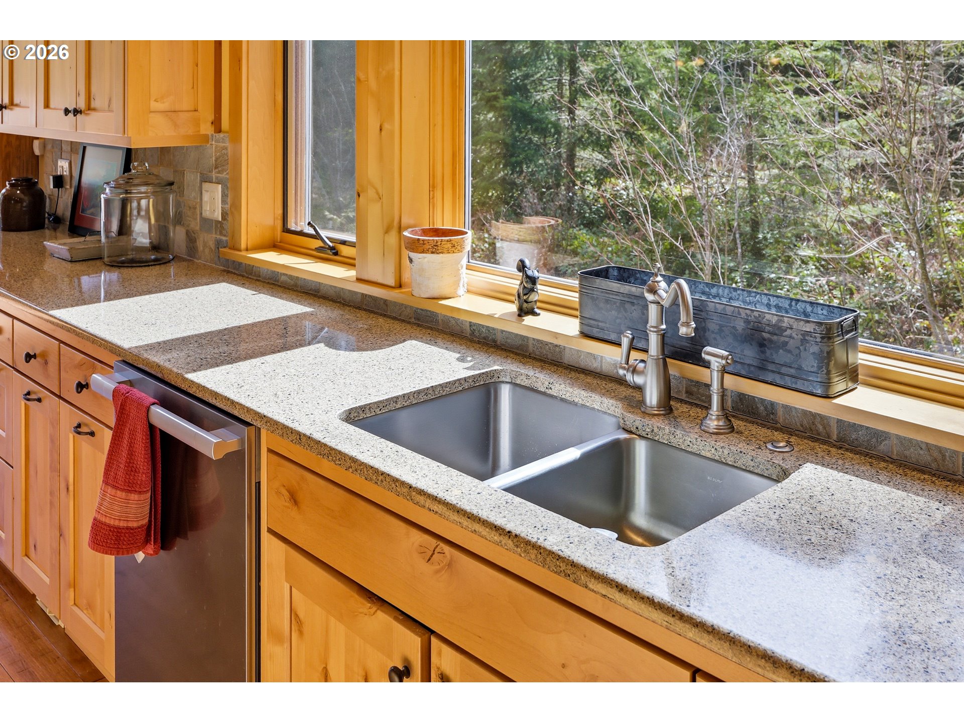 20680 East Glacier View Road Rhododendron, OR 97049 - Photo 12 of 48 a kitchen with a sink and a large window
