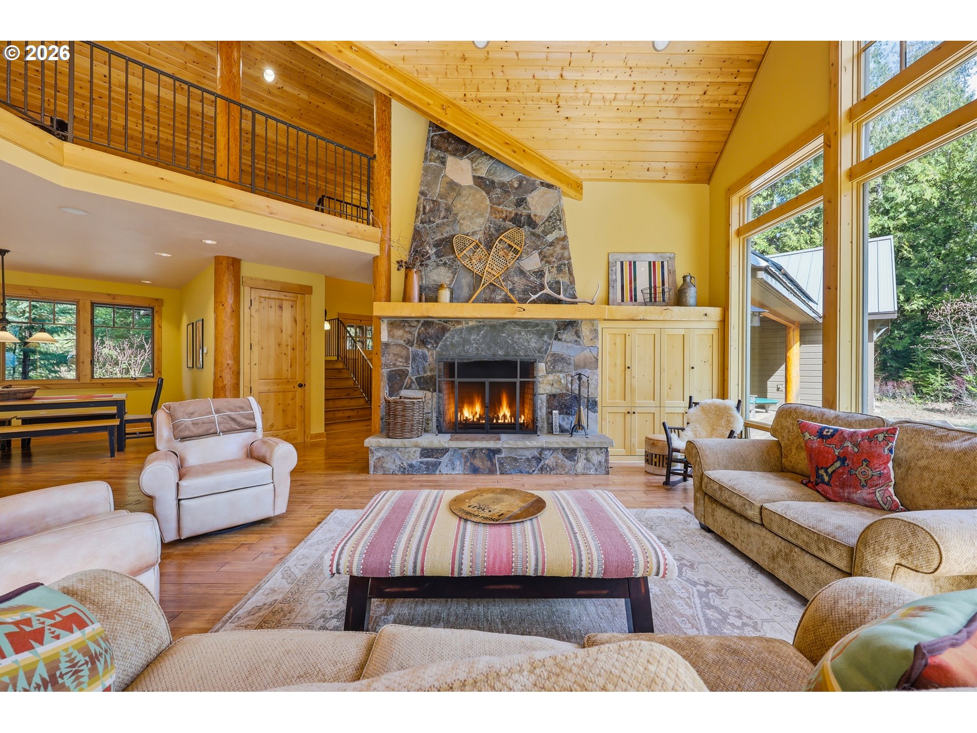 20680 East Glacier View Road Rhododendron, OR 97049 - Photo 18 of 48 a living room with furniture and a fireplace