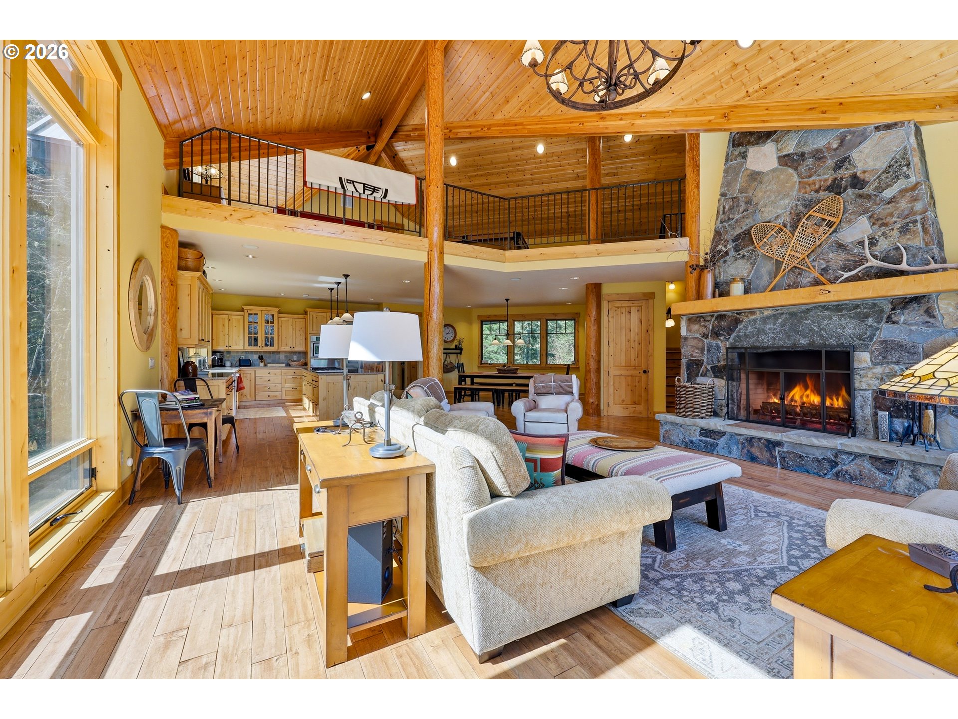 20680 East Glacier View Road Rhododendron, OR 97049 - Photo 19 of 48 a living room with furniture a fireplace and a flat screen tv