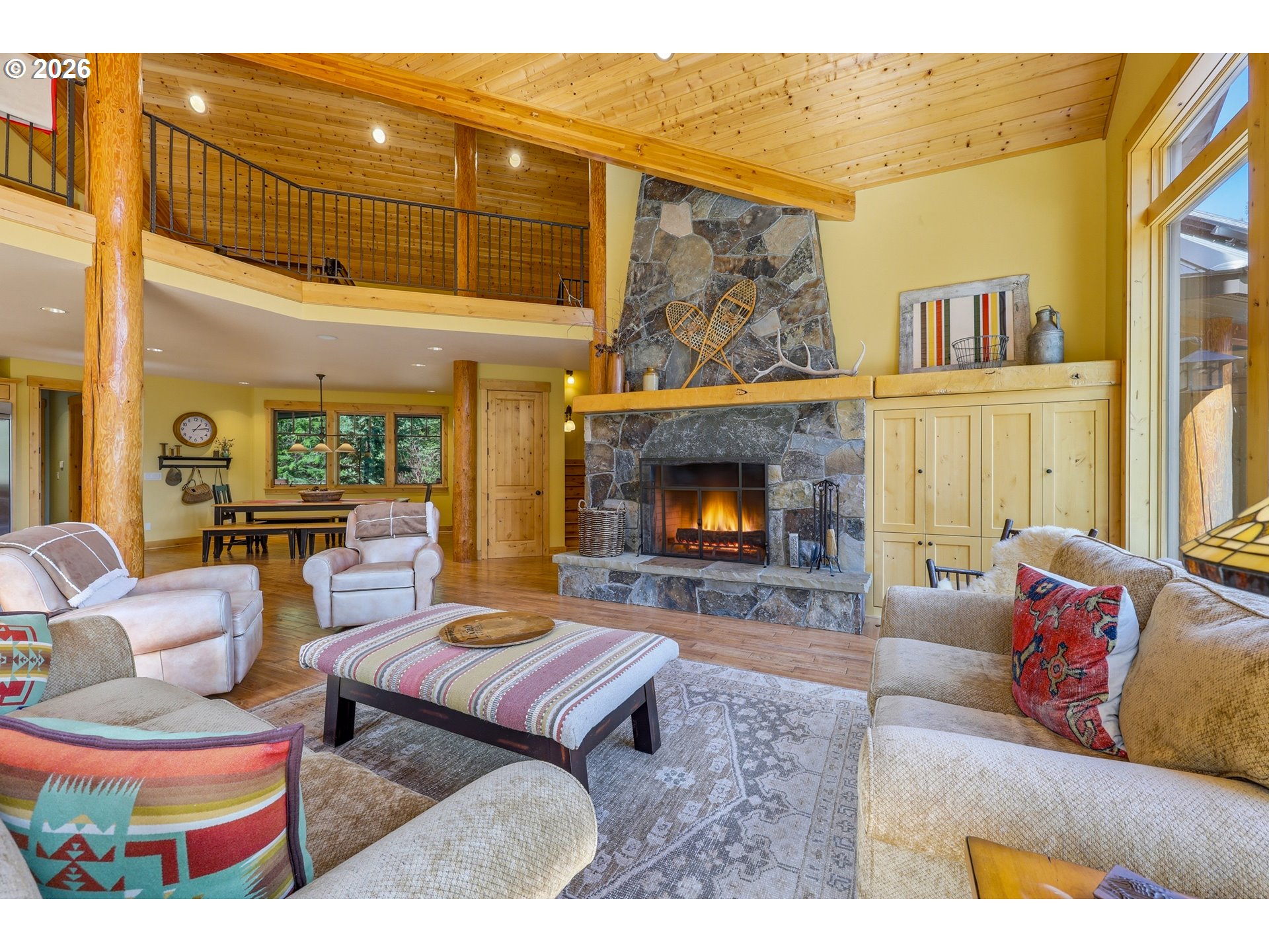 20680 East Glacier View Road Rhododendron, OR 97049 - Photo 20 of 48 a living room with furniture and a fireplace