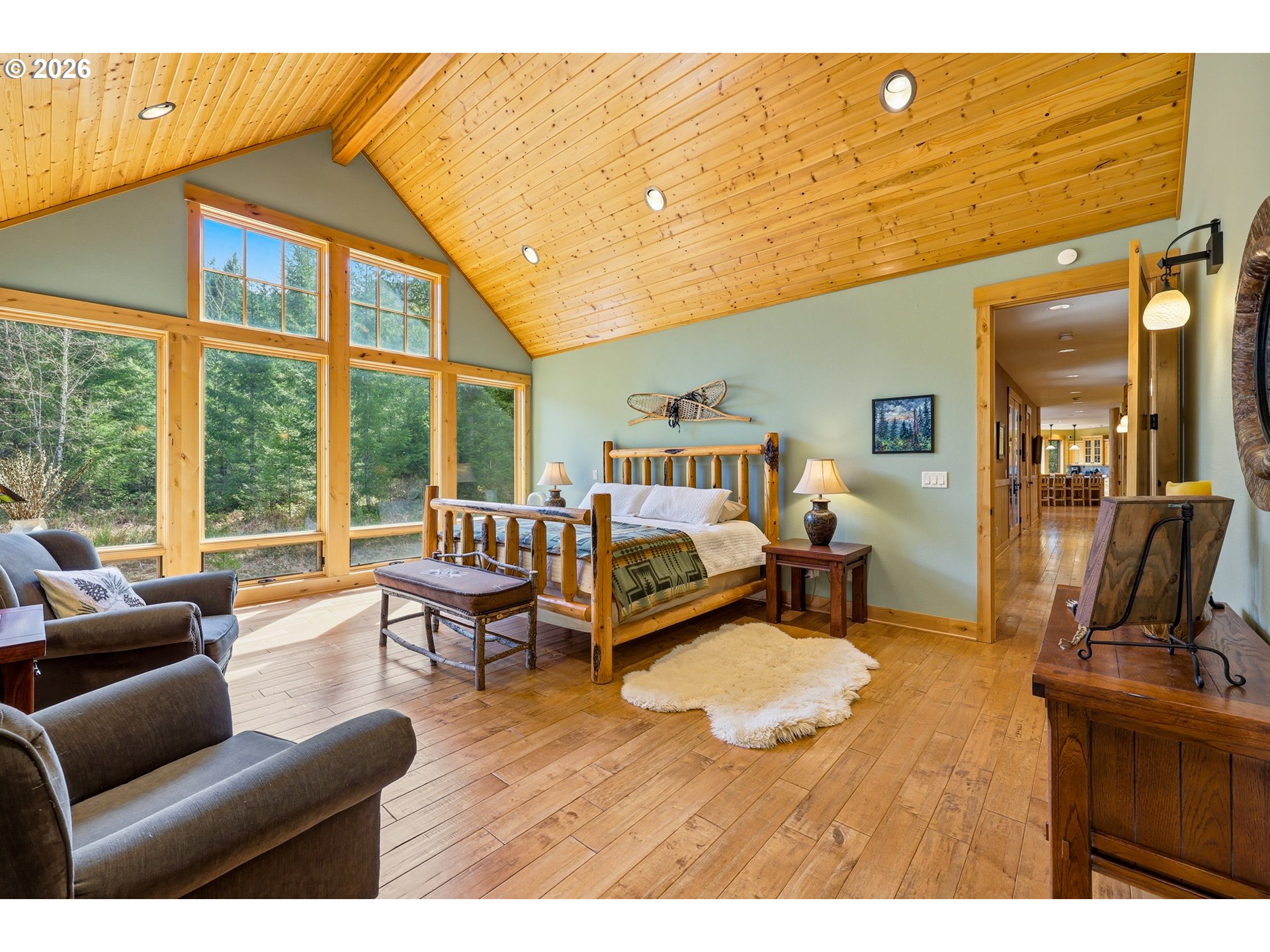 20680 East Glacier View Road Rhododendron, OR 97049 - Photo 25 of 48 a living room with furniture two large window and a flat screen tv