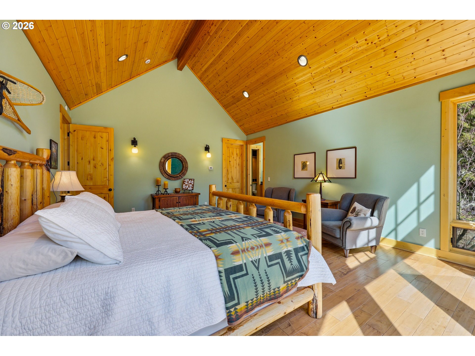 20680 East Glacier View Road Rhododendron, OR 97049 - Photo 26 of 48 a bedroom with a bed and wooden floor