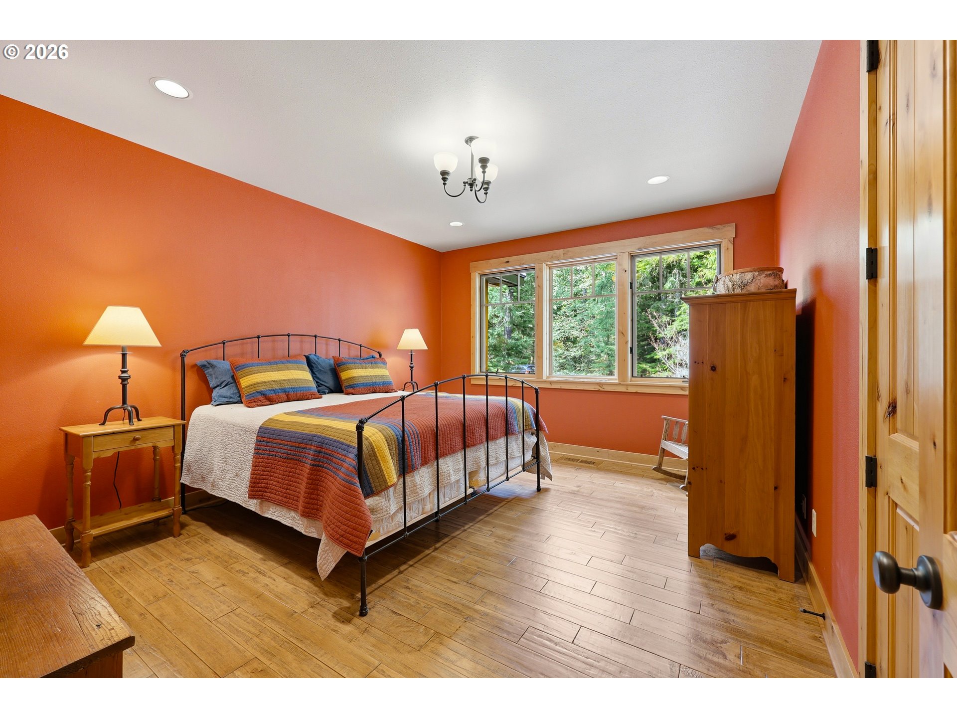 20680 East Glacier View Road Rhododendron, OR 97049 - Photo 33 of 48 a bedroom with a bed lamps and window