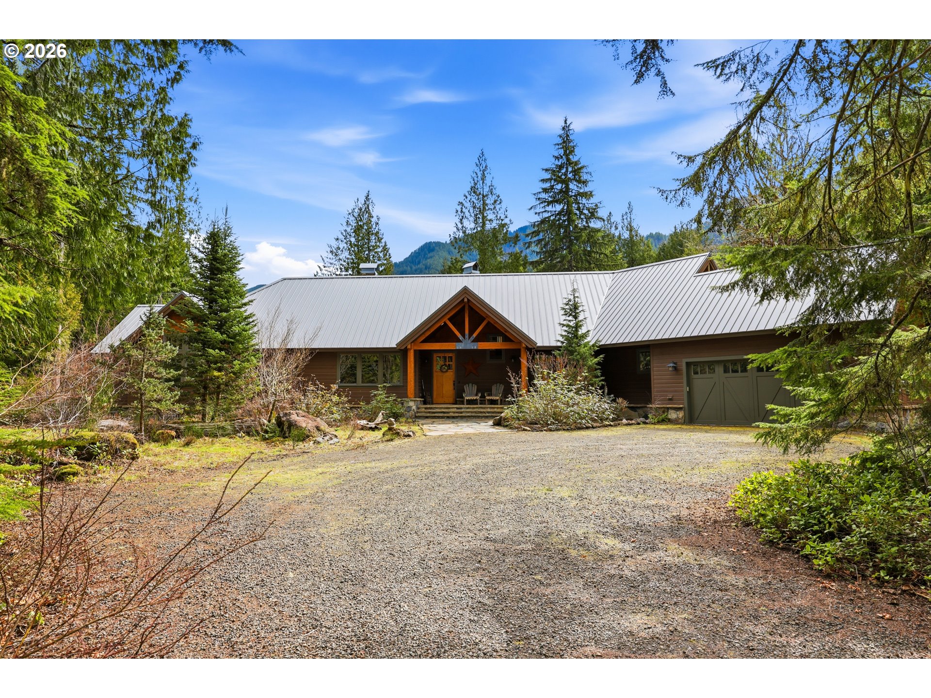 20680 East Glacier View Road Rhododendron, OR 97049 - Photo 4 of 48 a house view with a garden space