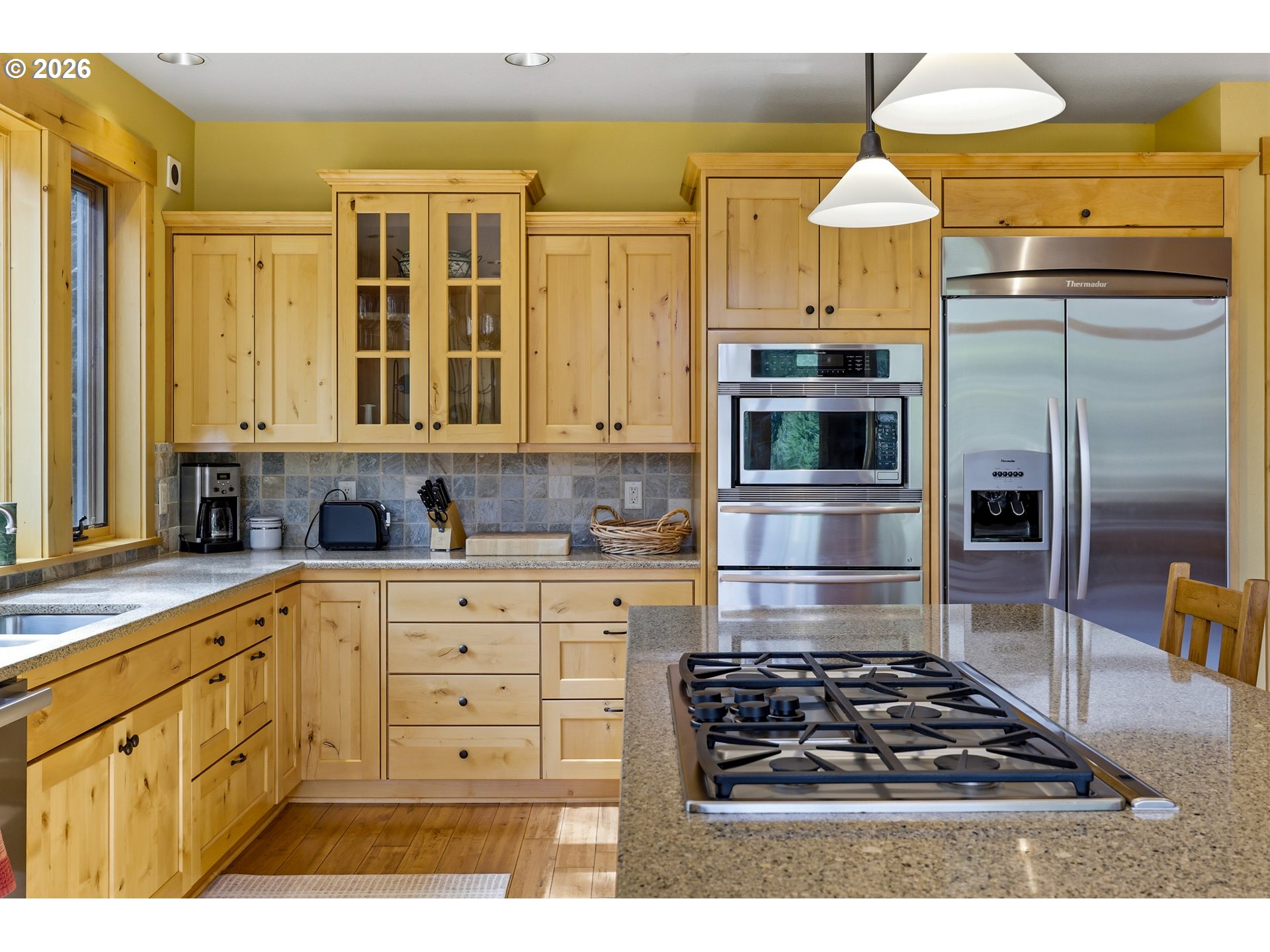 20680 East Glacier View Road Rhododendron, OR 97049 - Photo 10 of 48 a kitchen with stainless steel appliances a stove a sink and a microwave