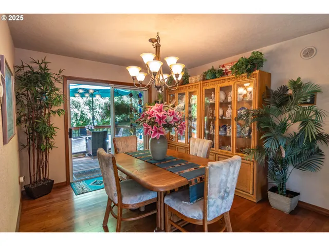 a dining room with furniture and chandelier