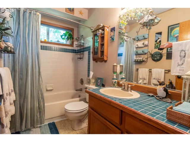 a bedroom with a bed dresser and a window